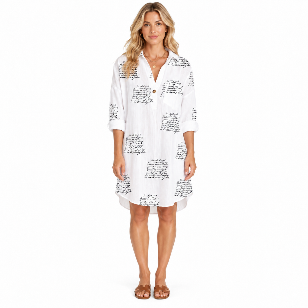 Letter Print Dress front view showing white shirt styling, black script print, collar, rolled sleeves and curved hem detail