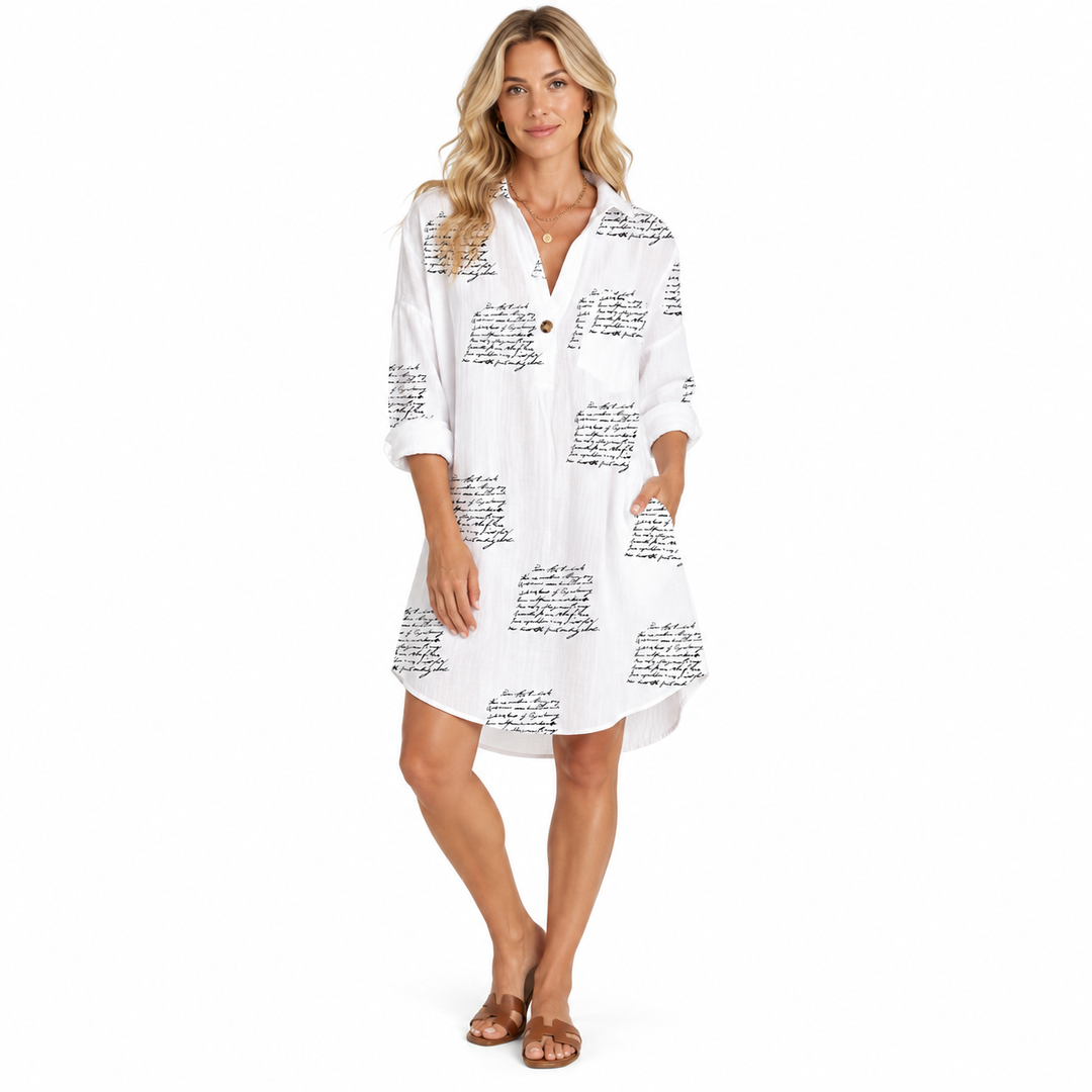 Letter Print Dress on model, full-body front view in white with black script print, rolled sleeves and simple flat sandals