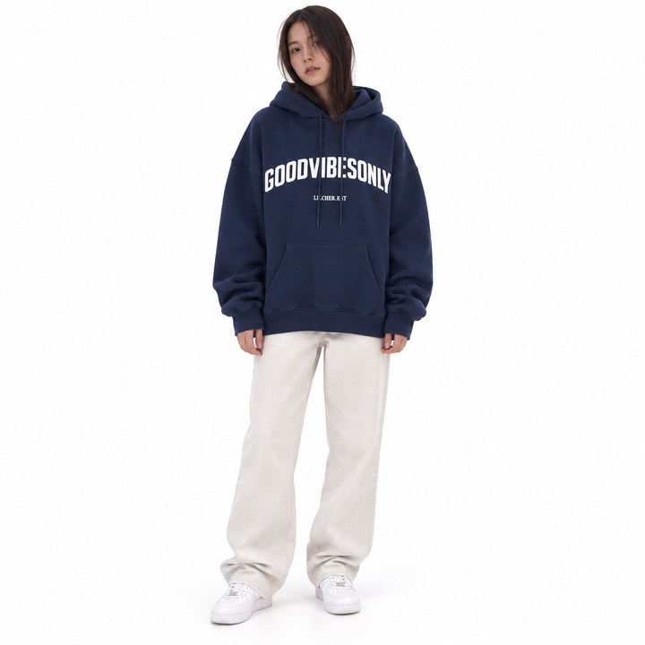 Navy blue letter print hoodie with chest print, drawstring hood and kangaroo pocket, shown on a brunette model against white.