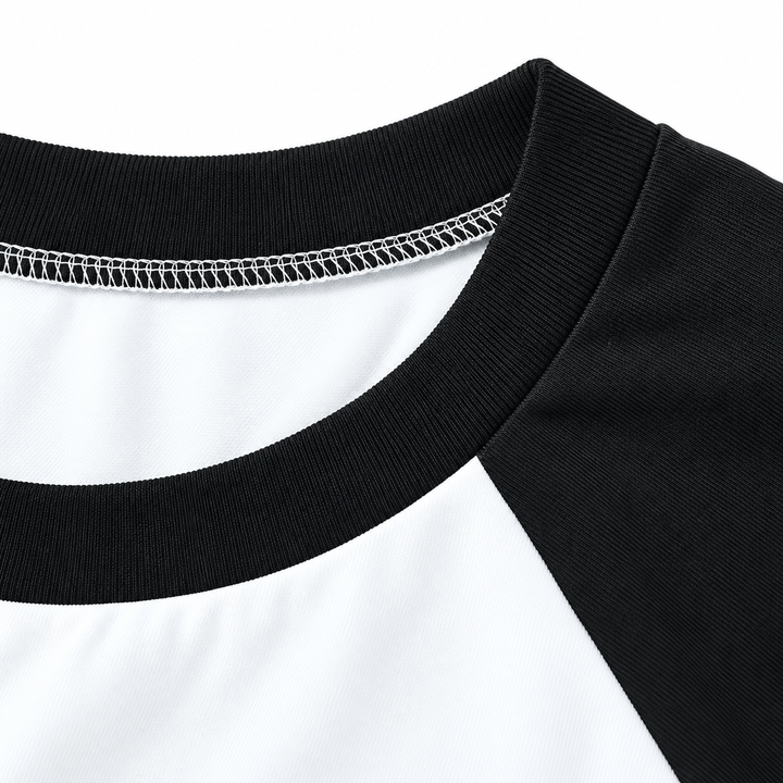 Black crew neckline and raglan seam detail on the white tee