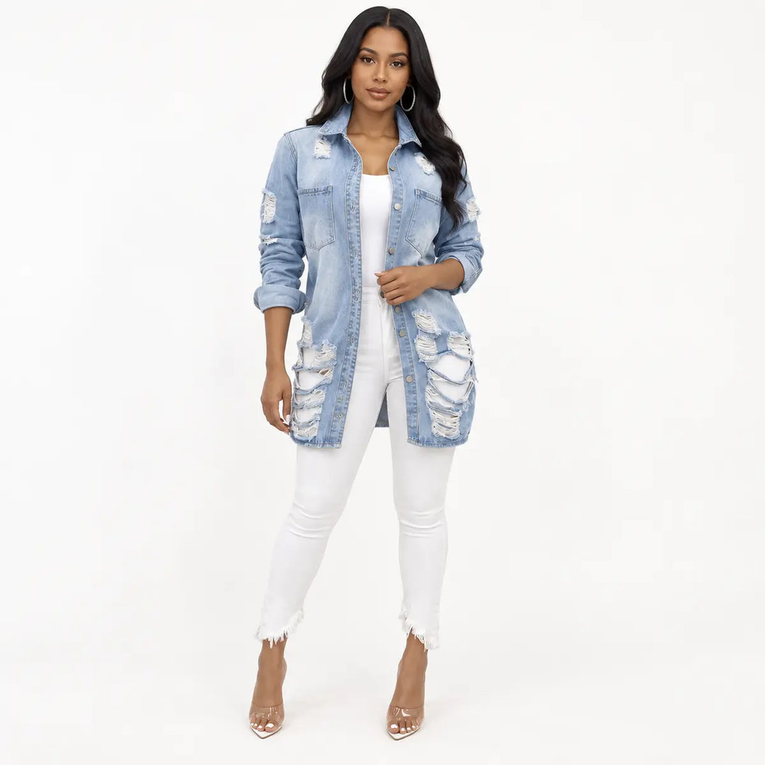 Full front view of a longline denim jacket with pointed collar, button closure, chest pockets and extensive distressed panels