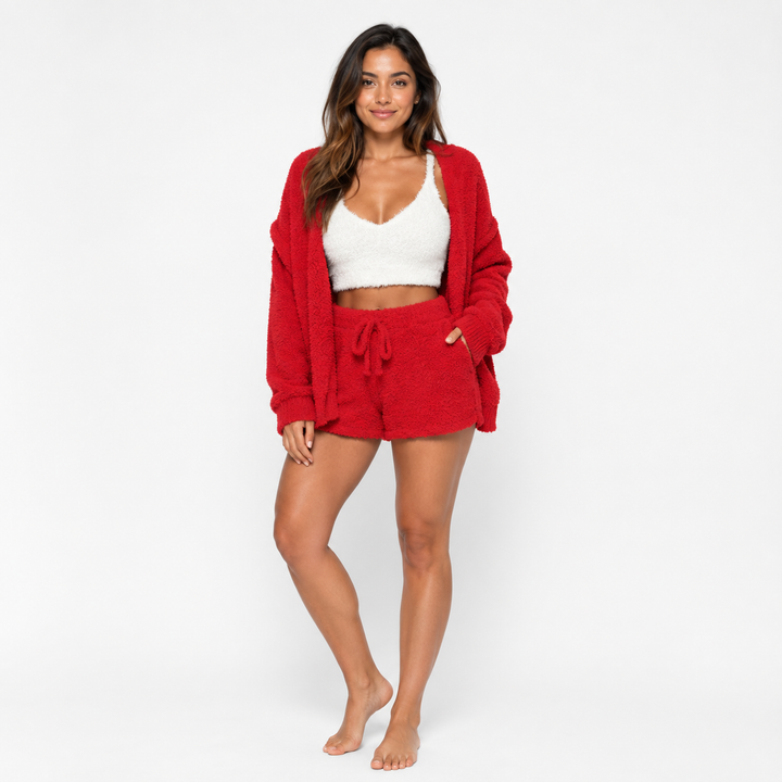 Red fuzzy cardigan and drawstring shorts set with white cropped top shown on a female model against a clean white background.
