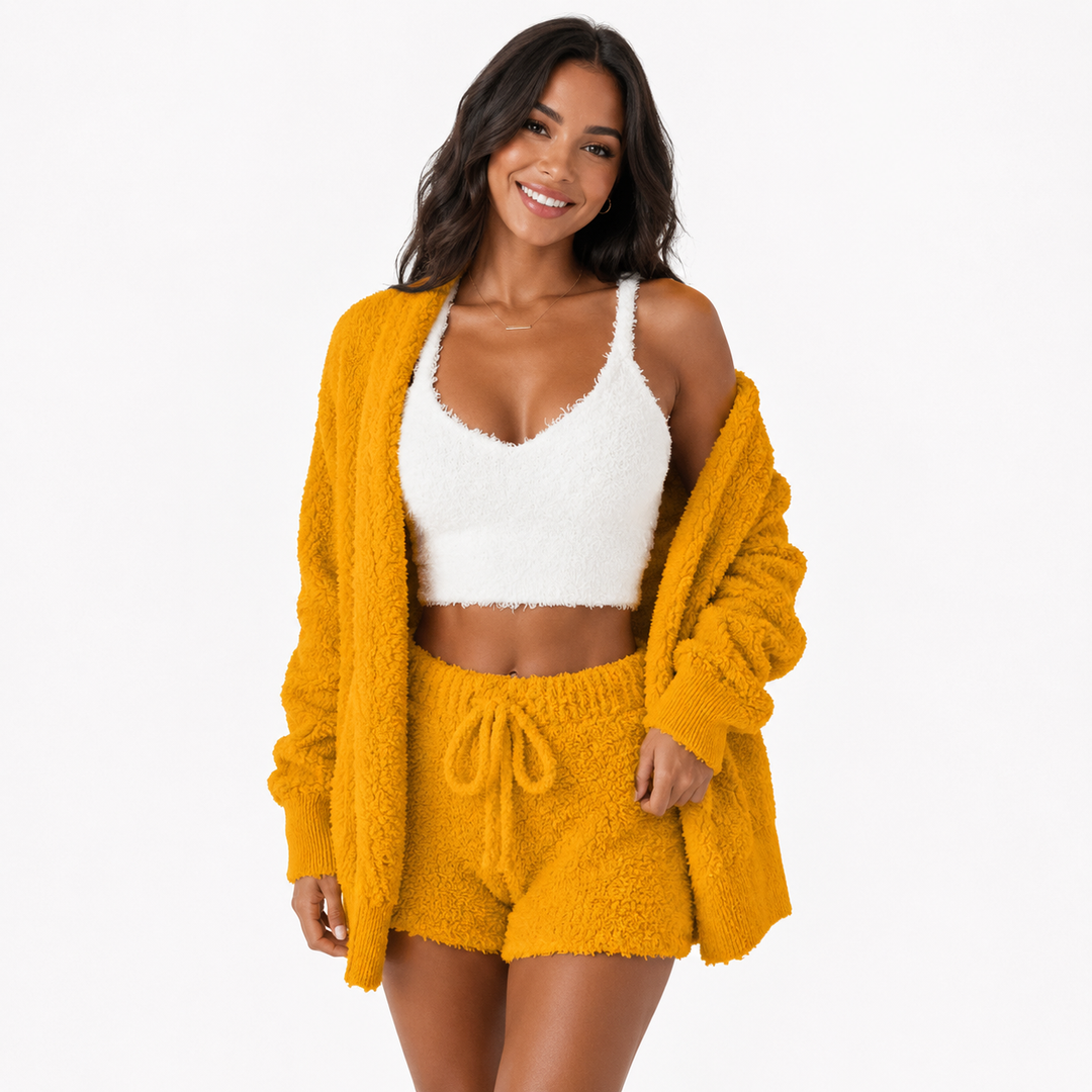 3 piece lounge set women in yellow with fuzzy open cardigan, white cropped top and drawstring shorts on a studio model image.