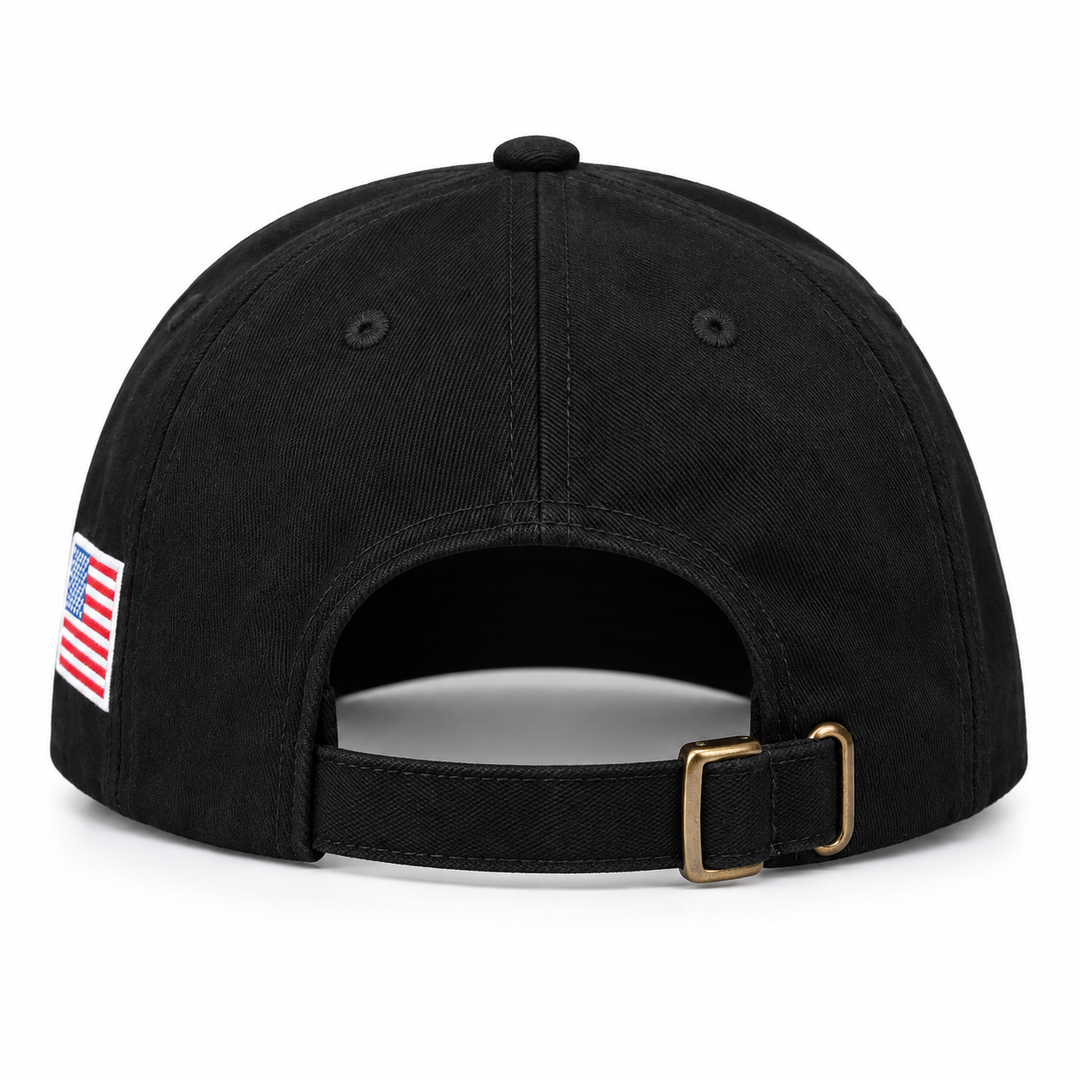 Rear view of a black baseball cap showing the adjustable strap, buckle and side flag patch on a white background.