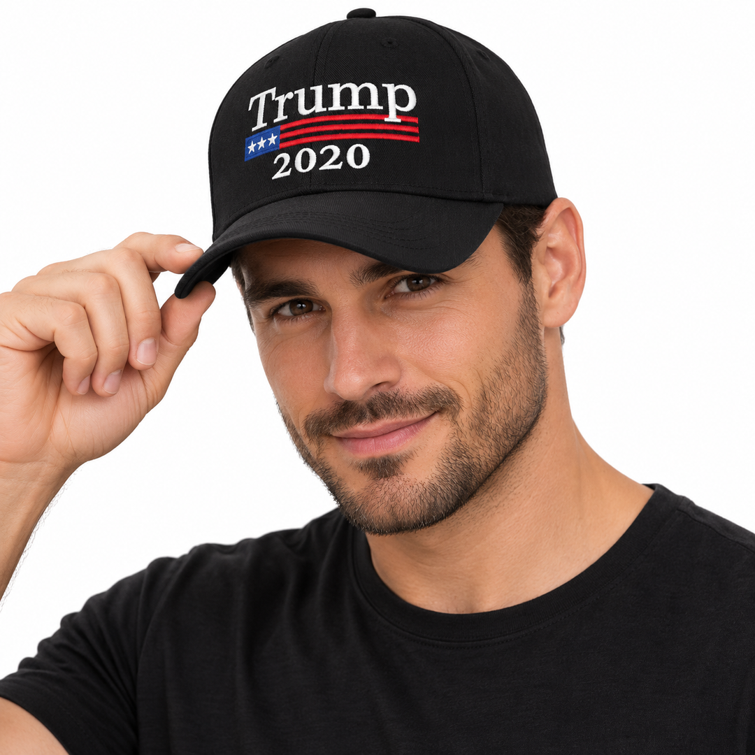 Male model wearing a black Trump 2020 embroidered baseball cap with red and blue front detail.
