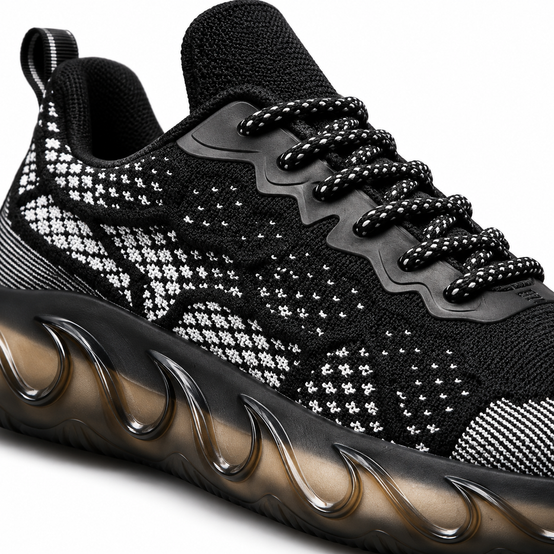 Close-up of black woven mesh shoe laces, upper pattern and sculpted sole