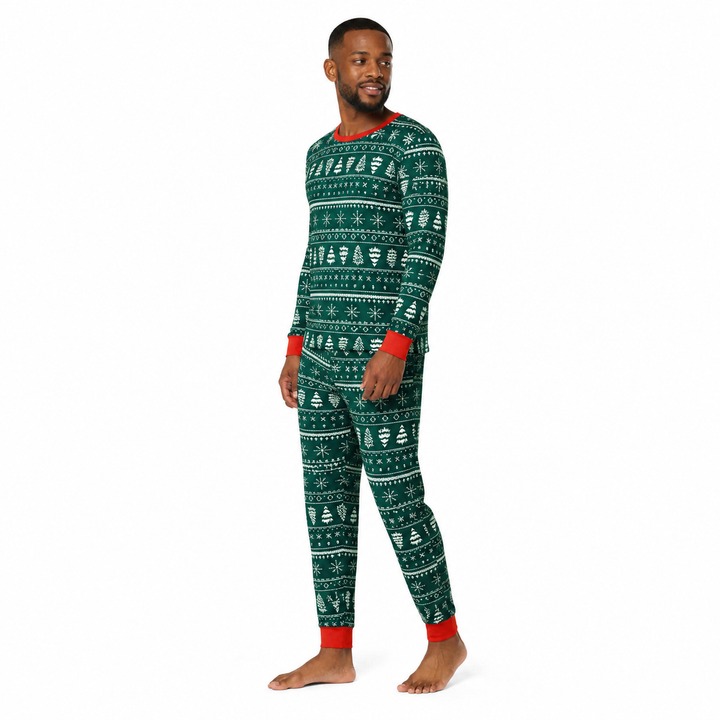 Man modeling green matching Christmas pajamas in a three-quarter side pose on a white background.