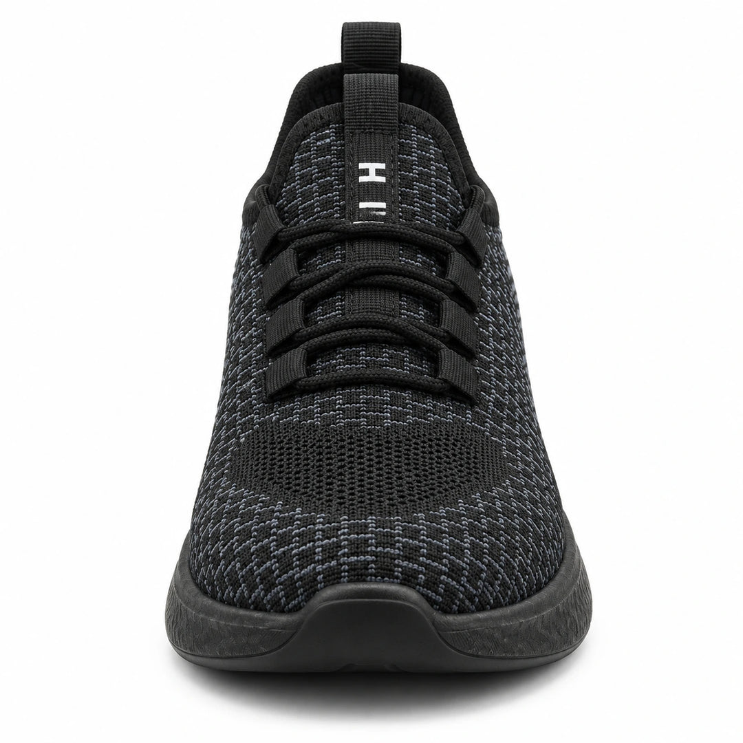 Front view of Black Style 1 knit work shoe showing the toe, black laces and knit tongue.