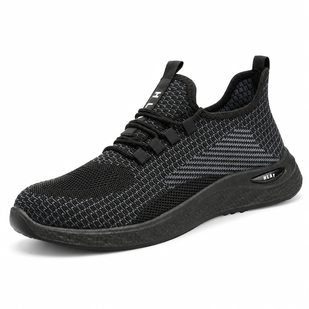 Outer side view of Black Style 1 knit work shoe with a black PVC sole.
