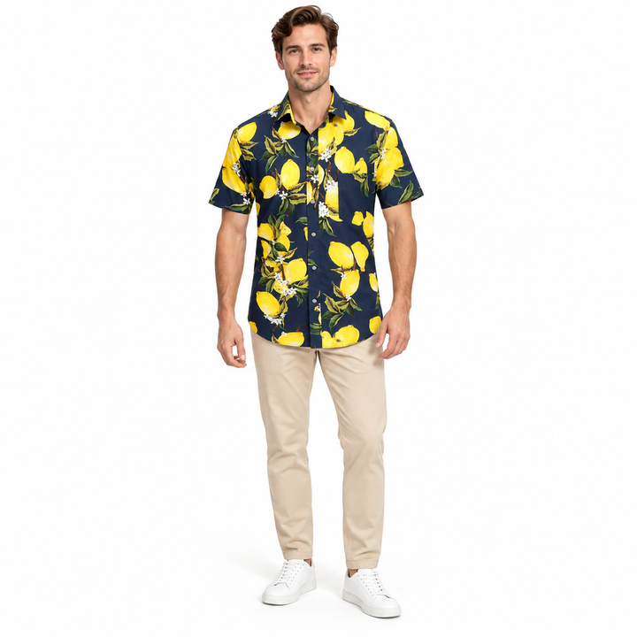 Model wearing a navy lemon print shirt in a full-body front view with trousers and shoes visible on a plain white background.