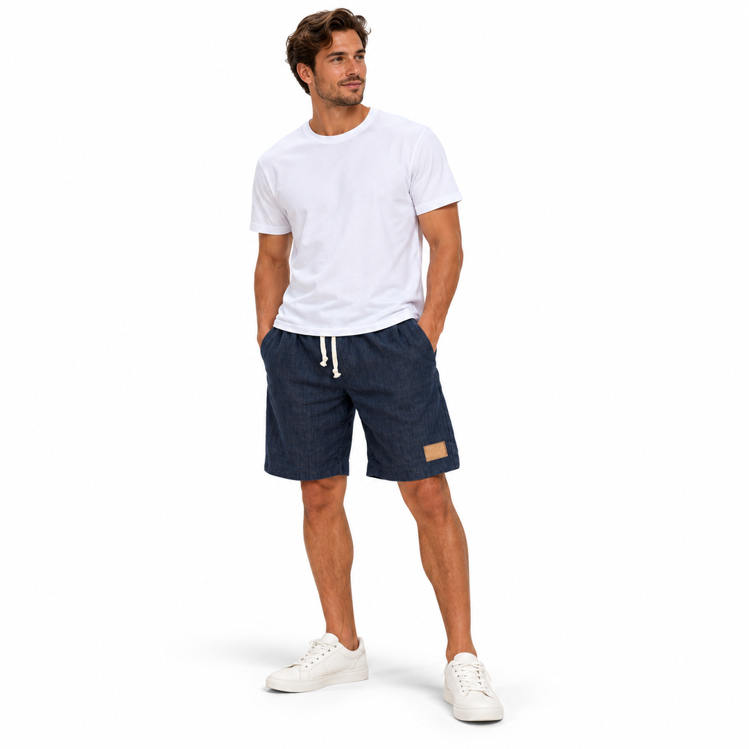 Men's linen shorts in navy on full-body male model, main front lifestyle image
