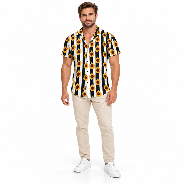 Adult model wearing the black white and yellow sunflower collared shirt with beige trousers and white sneakers against white.