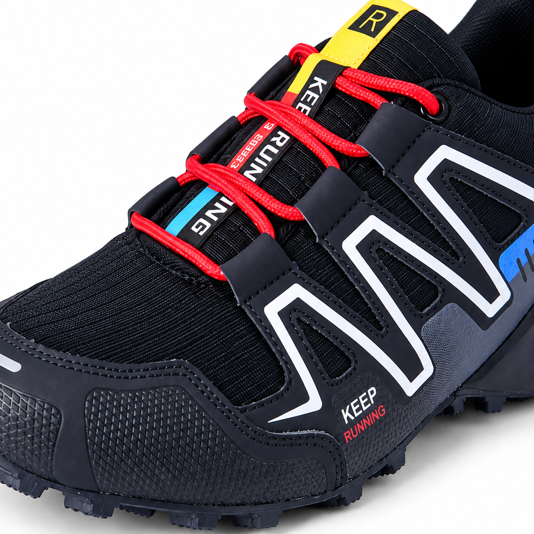 Close-up of black trail running shoe laces, upper panels and toe detail