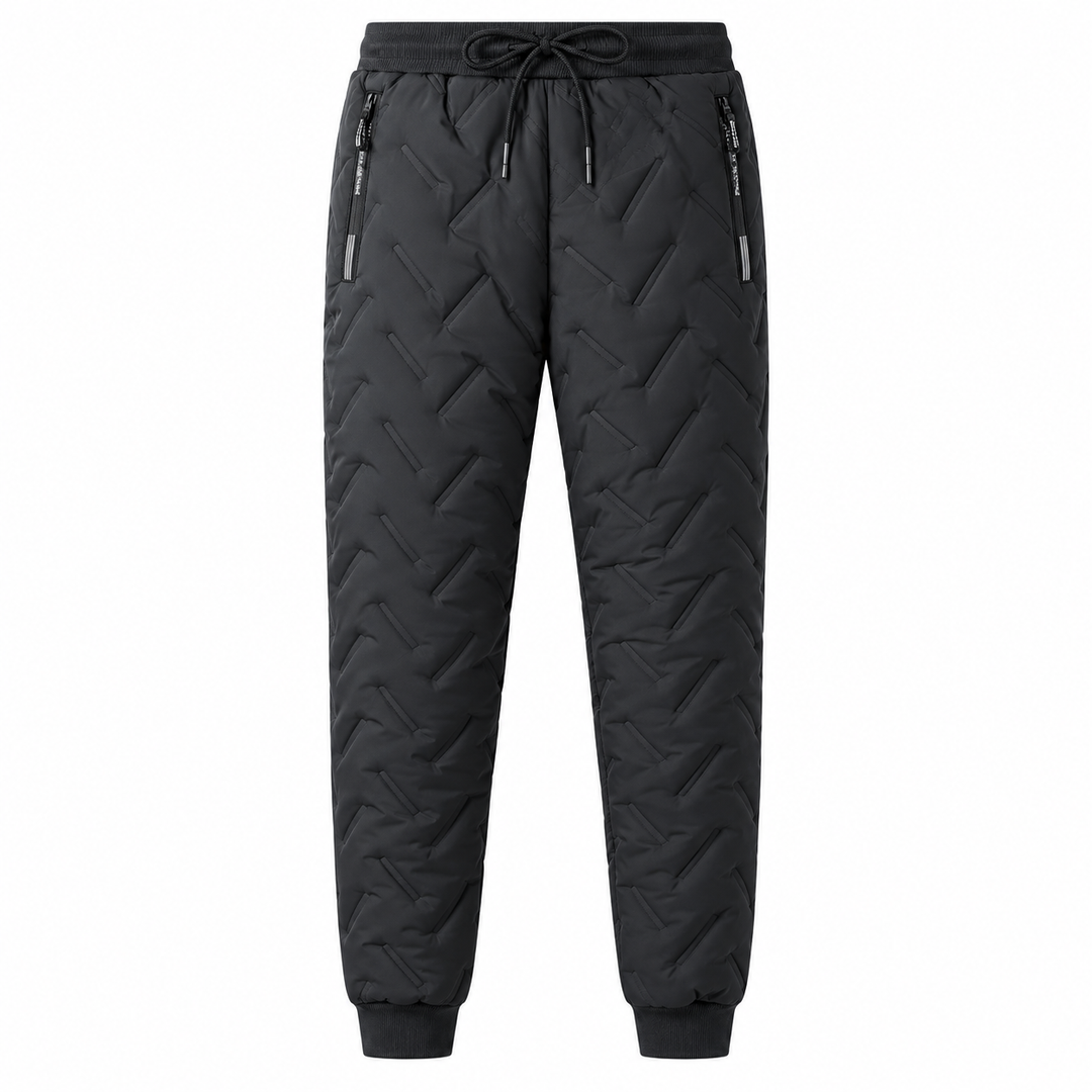 Black quilted winter pants front view with drawstring waist, zip pockets and cuffed ankles