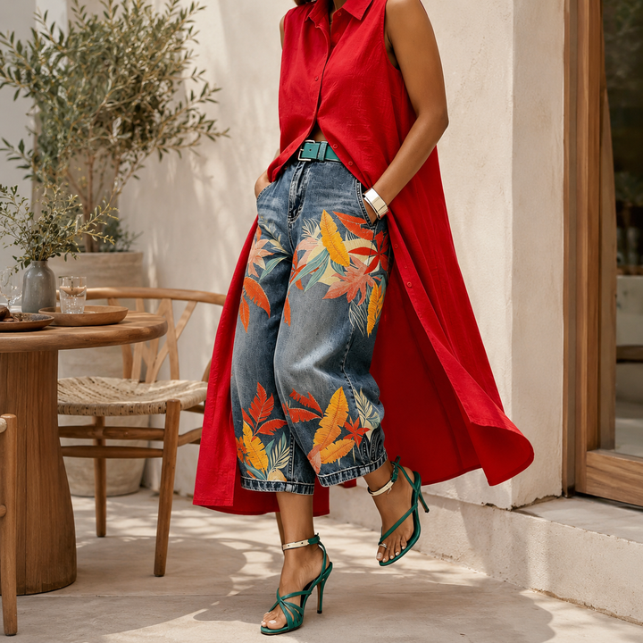 Printed wide-leg denim capri pants styled in a premium lifestyle setting