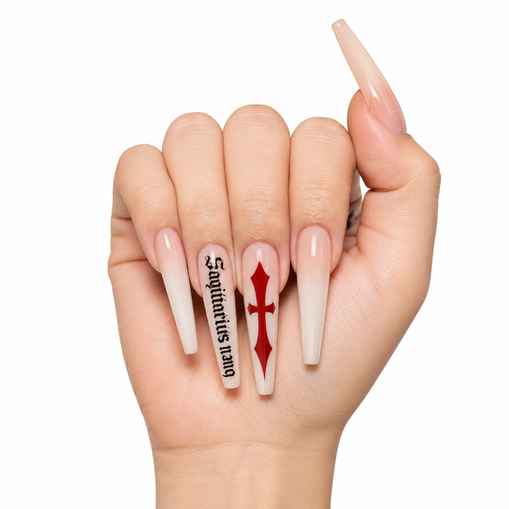 Front view of milk white cross press on nails with red cross art, black gothic script details and the full coffin nail shape.