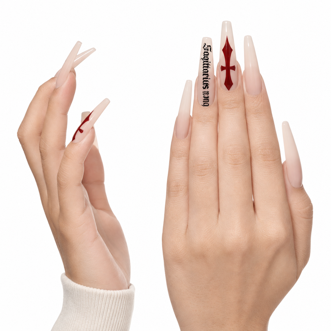 Hero view of milk white cross press on nails with red cross detail black gothic script artwork and clean product arrangement.