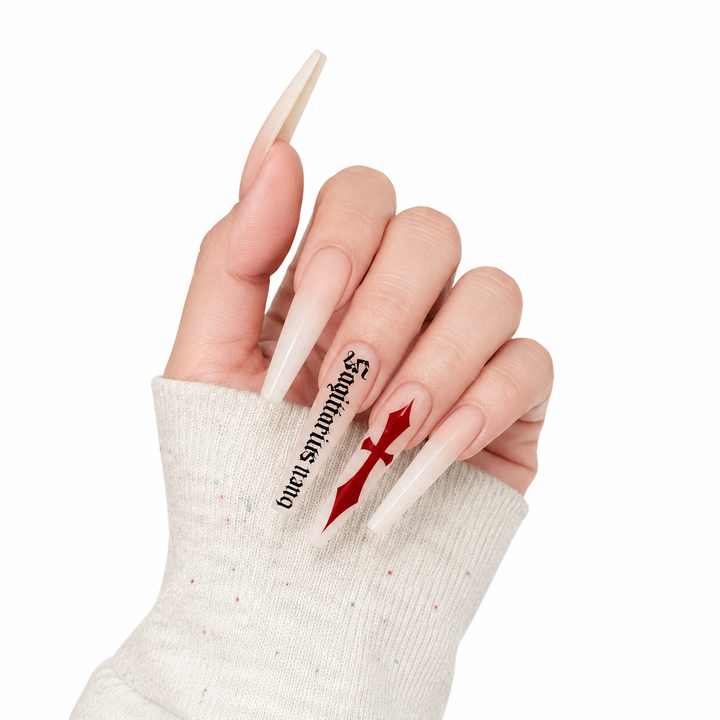 Side view of milk white cross press on nails showing profile glossy finish, red cross artwork and black gothic script detail.