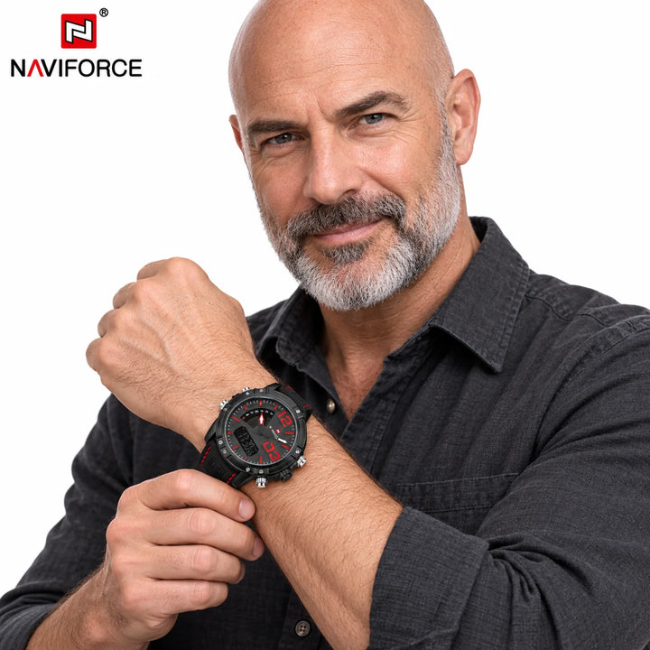 Bald male model with grey beard wearing the black leather band watch with red dial accents and stitching on white background.