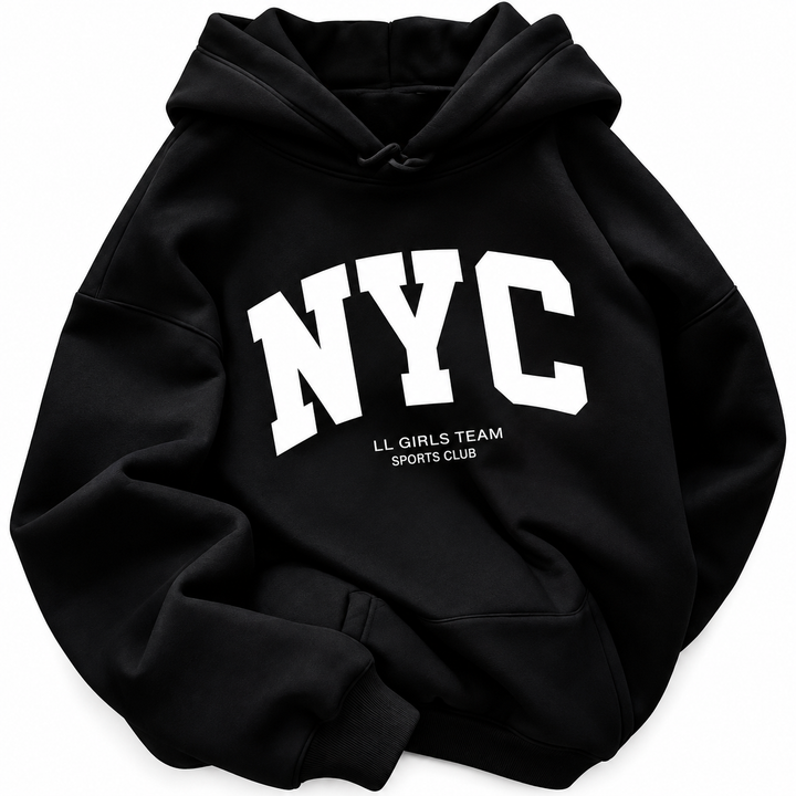 Close view of the black hoodie with white NYC lettering, a kangaroo pocket and drawstrings against a white studio background.