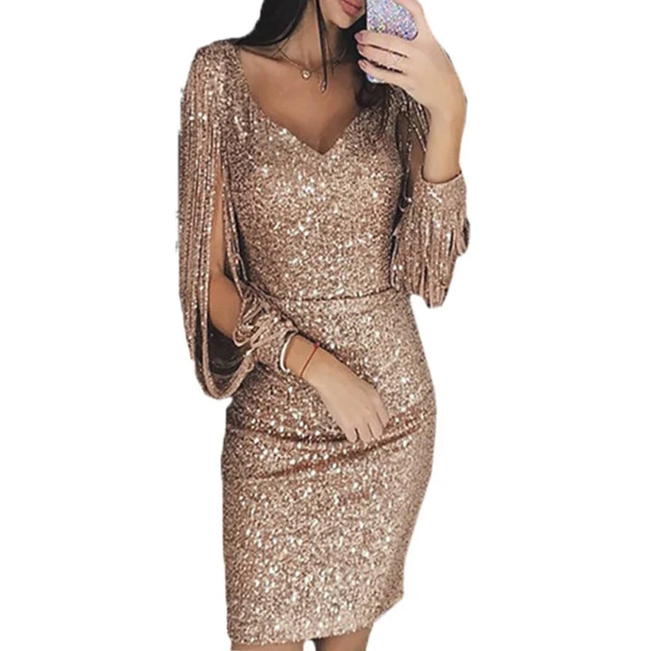 Gold V-neck mini dress in a white background cutout showing a slim fit, tassel sleeves and a shimmer finish for outfit ideas.