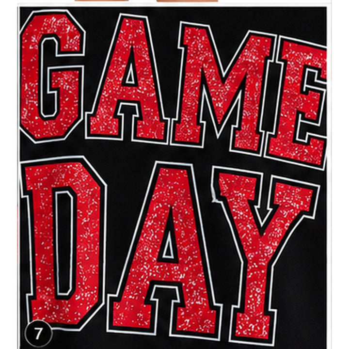 Close-up of distressed red GAME DAY varsity lettering with contrast outlines on the black sweatshirt front.
