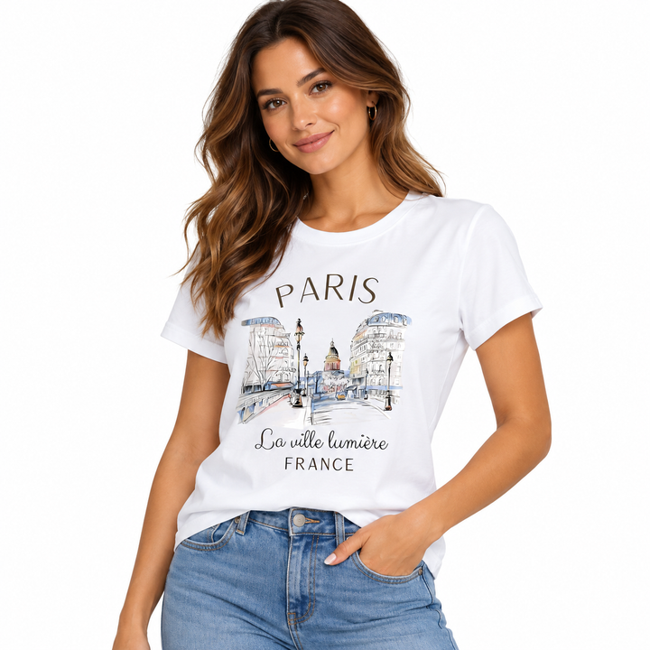 Paris graphic T-shirt for women modeled in three-quarter pose with white city print tee and casual blue denim styling outfit.