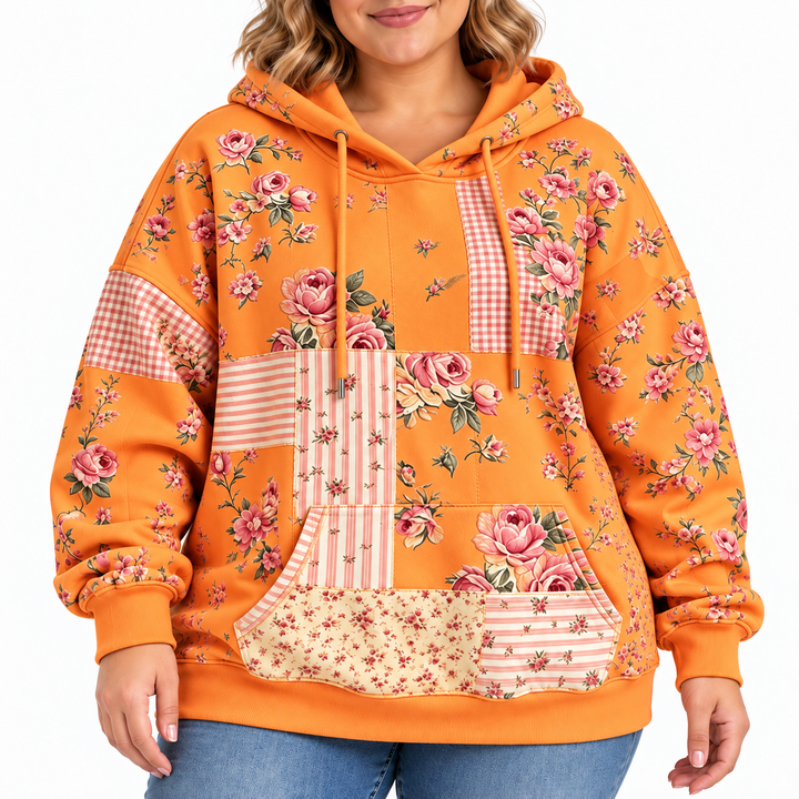 Plus size floral hoodie in tangerine, close-up showing pink rose print, drawstrings, kangaroo pocket and cuffs