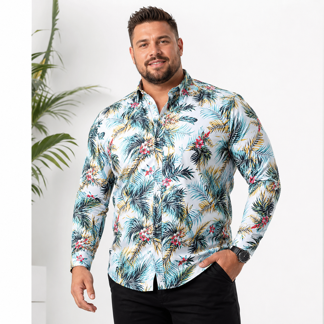 Plus-size male model wearing a light blue tropical print long-sleeve button-up shirt in a bright studio setting.