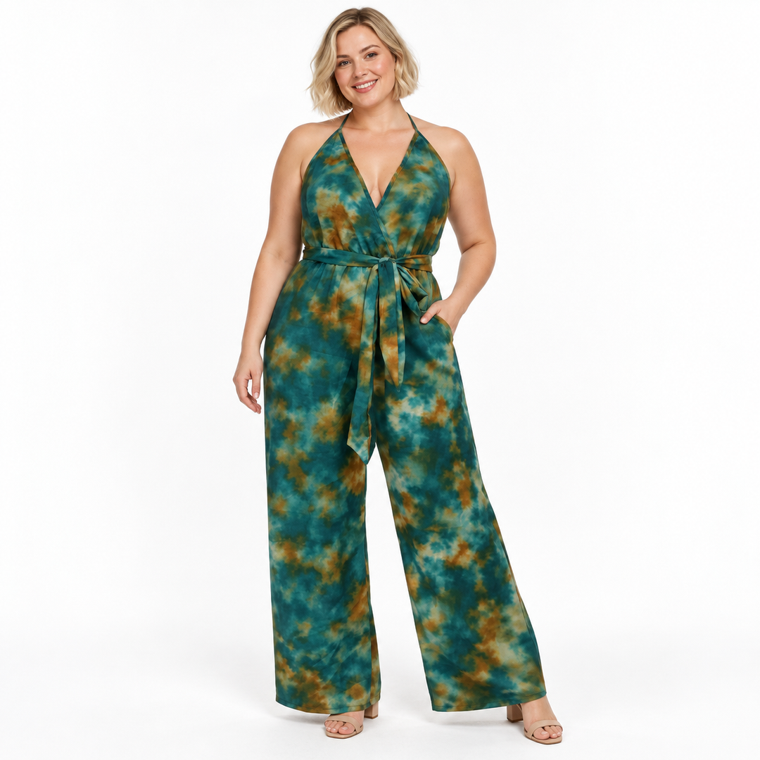 Plus size tie dye jumpsuit on a blonde model, full-length view against a white background