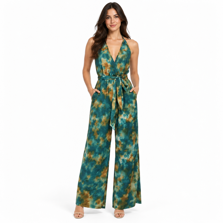 Dark Green color option shown on a full-length model wearing the patterned halter jumpsuit