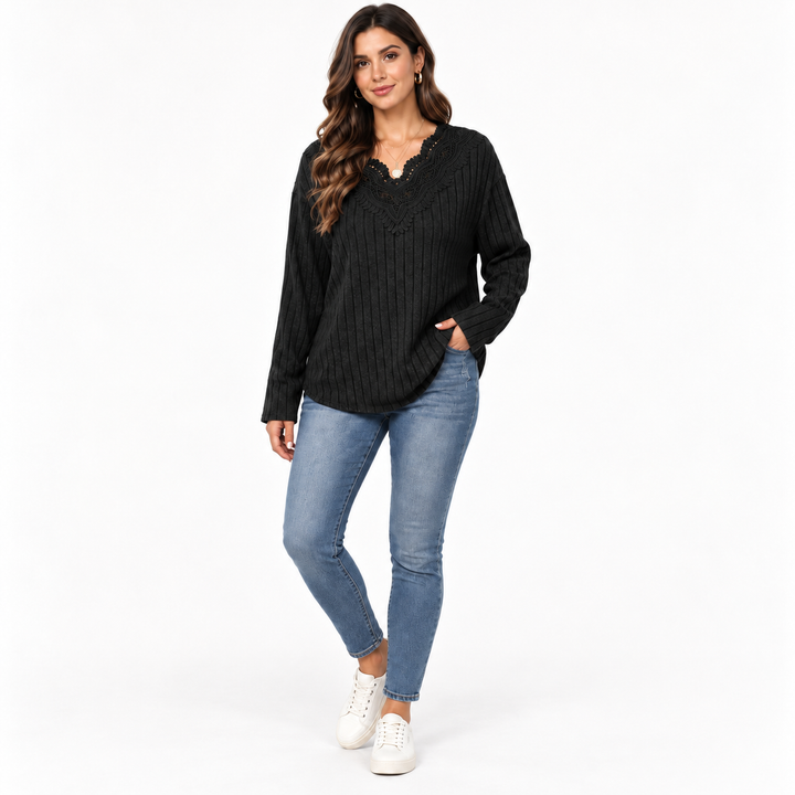 Woman styling black V-neck pullover sweater with denim