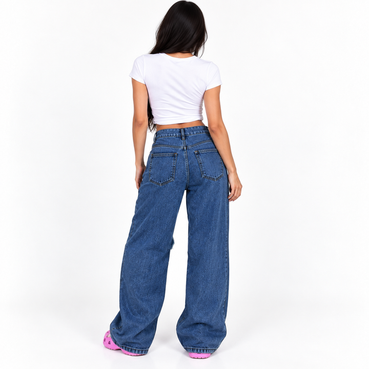 Back view of dark blue wide leg jeans showing rear pockets, waistband seams and full relaxed denim silhouette.