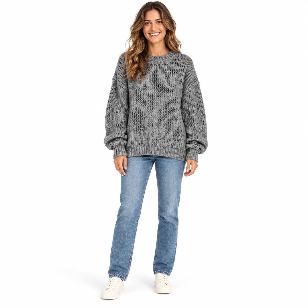 Charcoal Gray textured knit pullover on a full-length female model, showing round neckline, relaxed sleeves and ribbed cuffs.