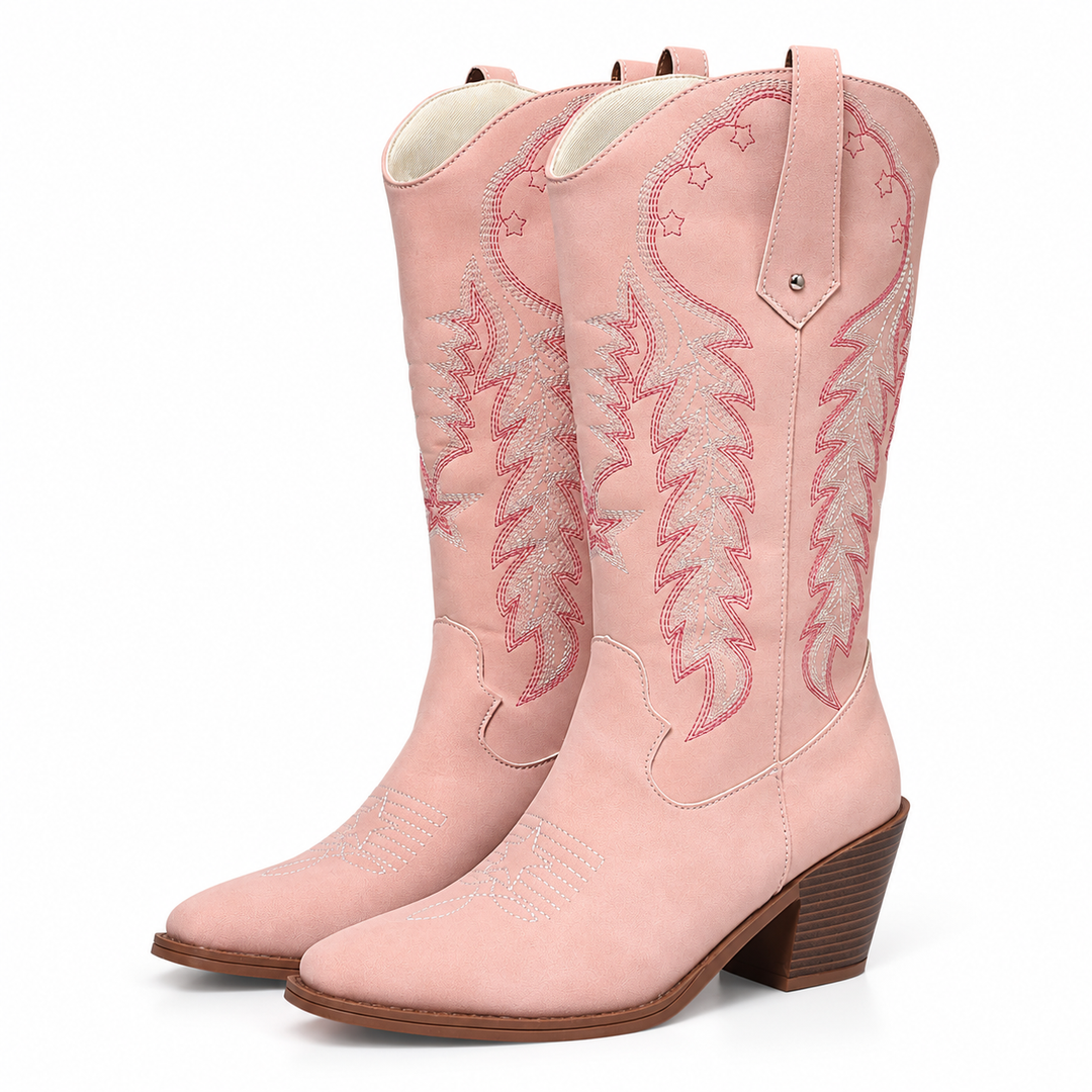 Pink women's cowboy boots with embroidered shafts, pointed toes and chunky brown heels shown as a pair on a white background.