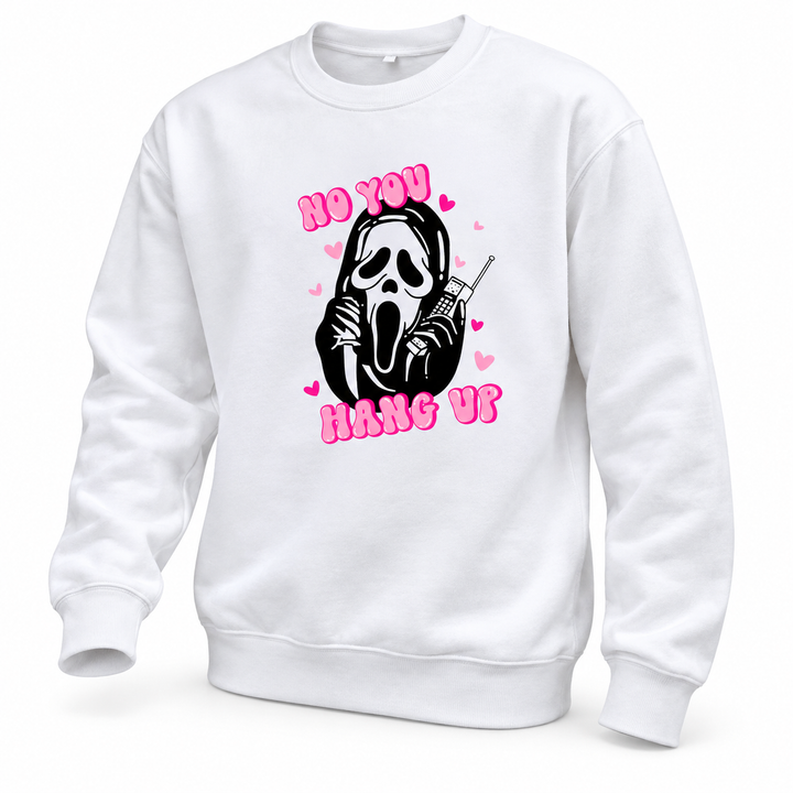 White pullover shown at an angle with pink lettering, a black mask and phone graphic, and long sleeves on a white background.
