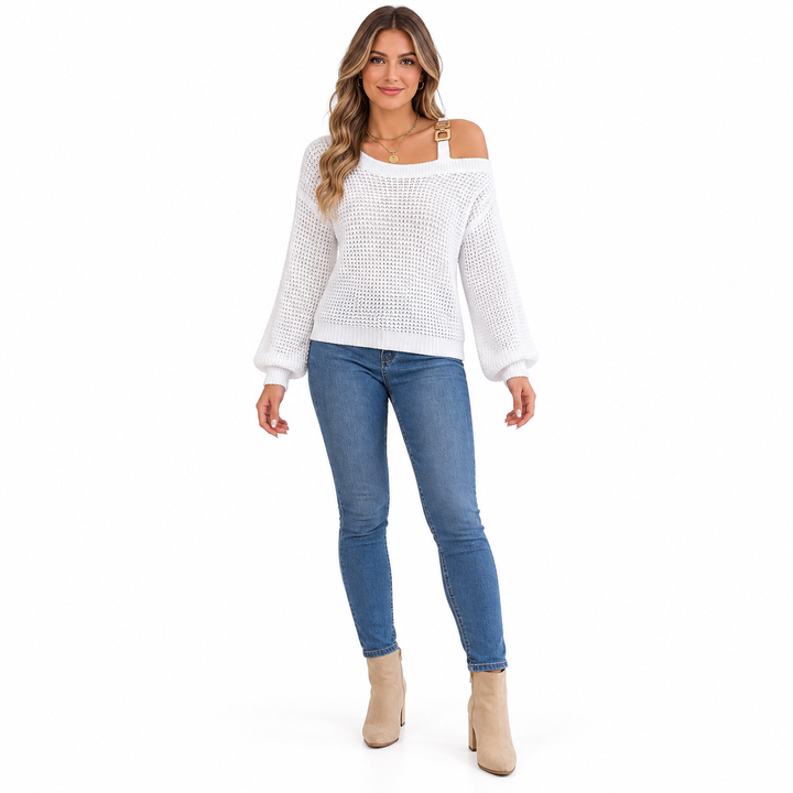 Front view of white off shoulder sweater with lantern sleeves and a metal buckle strap, worn with blue jeans and ankle boots.