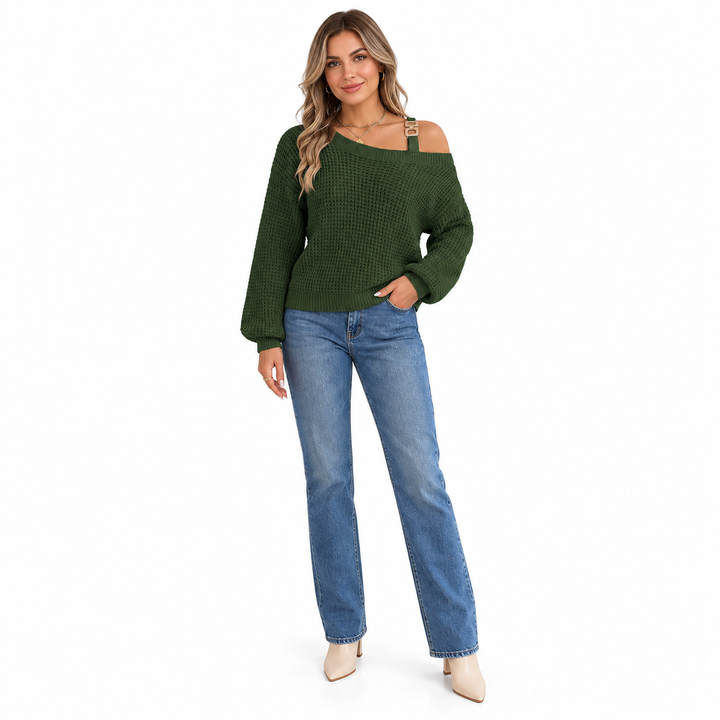 Army Green knit sweater with metal buckle strap and long lantern sleeves, worn with blue jeans against white studio backdrop.