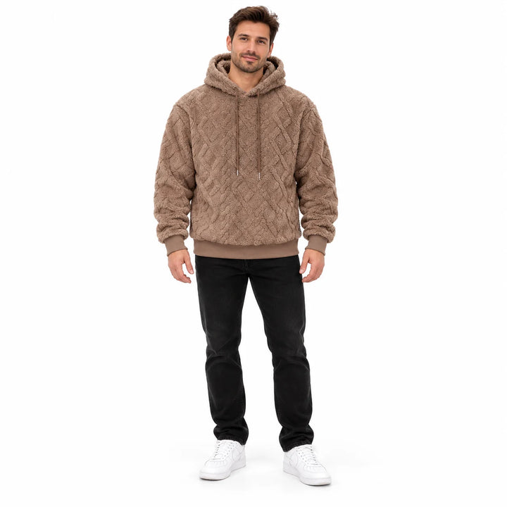 Jacquard hoodie in camel brown shown on a male model from head to toe, with geometric texture, drawstring hood and rib cuffs.