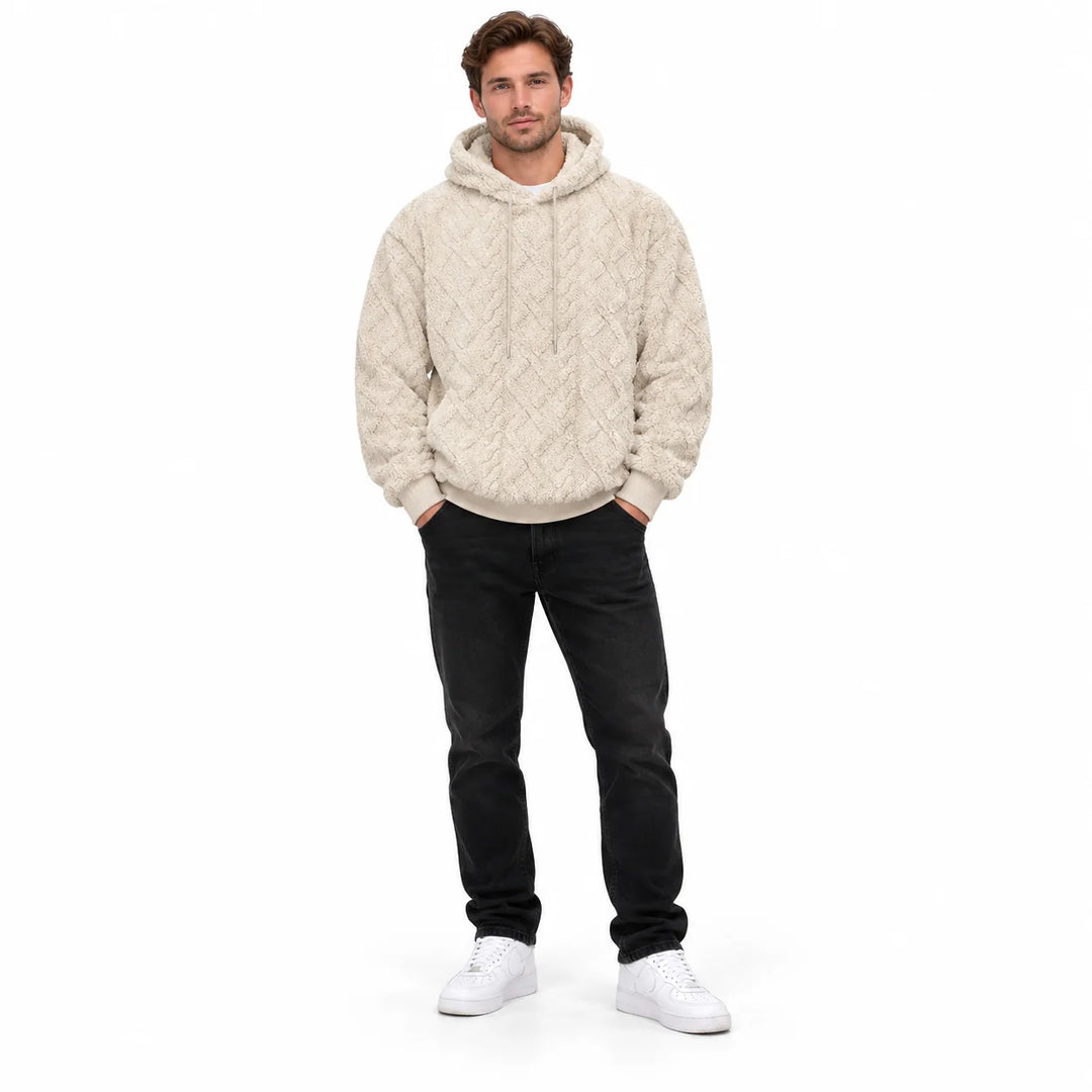 Khaki-cream pullover shown from the front on a full-length male model with textured geometric pattern and matching hood ties.