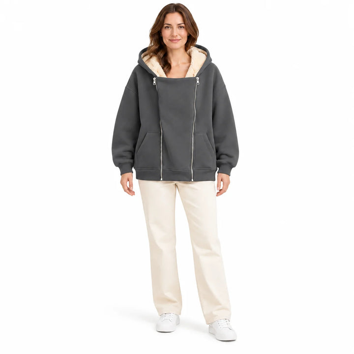 Charcoal Gray hooded sweatshirt on a full-body adult model, showing a big front panel, two silver zippers and angled pockets.