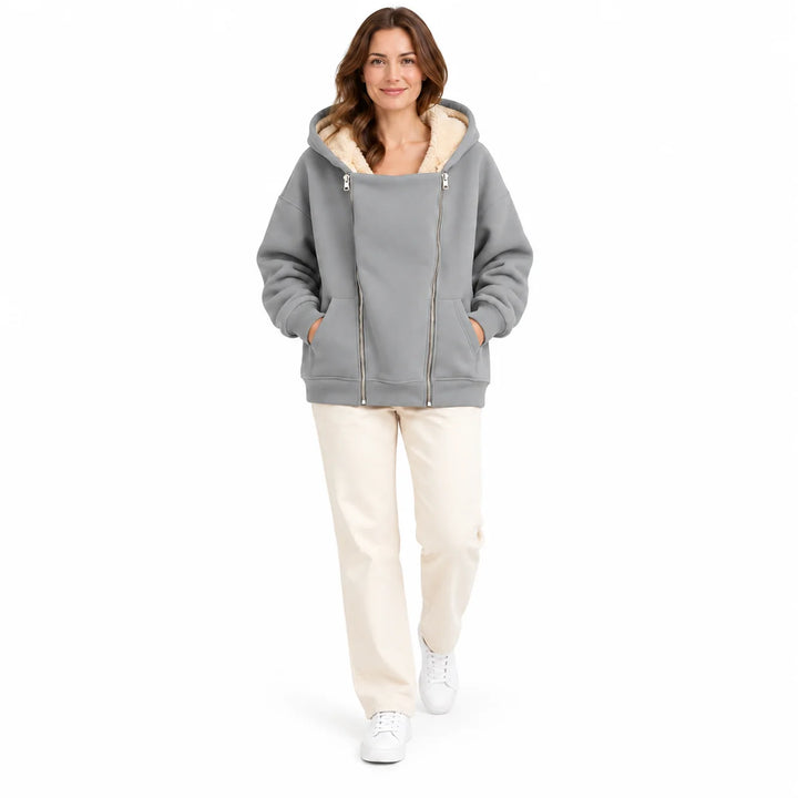 Light Gray hooded sweatshirt on a full-body adult model in a relaxed studio pose, with twin zippers and angled front pockets.