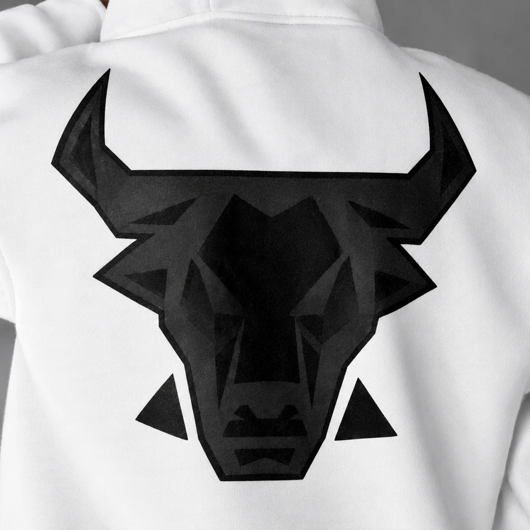 Close detail of the black angular bull head graphic printed on white fabric across the back of the hooded pullover sweatshirt