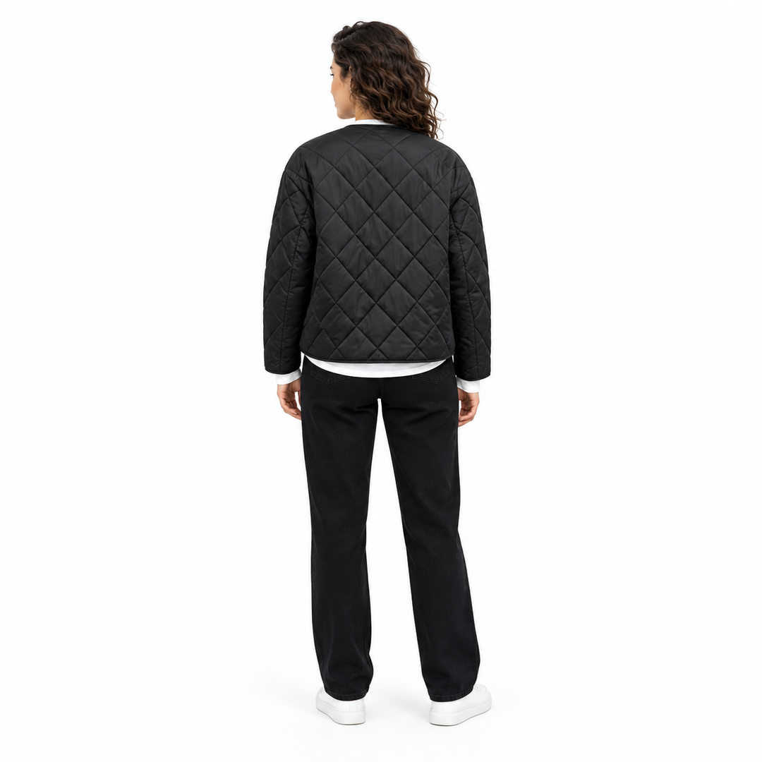 Back view of Black diamond-quilted jacket on a full-body model