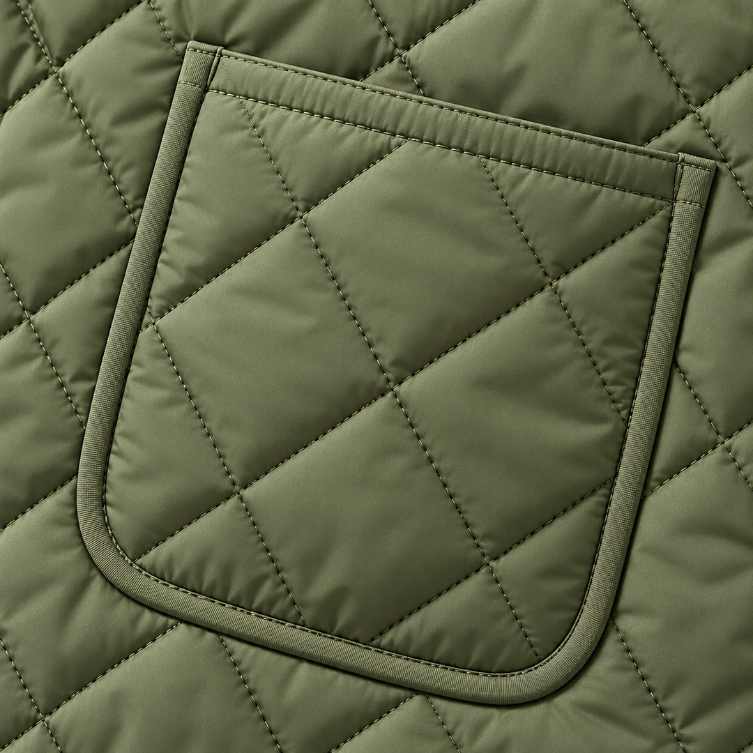Close-up of the Green quilted jacket patch pocket and diamond stitching