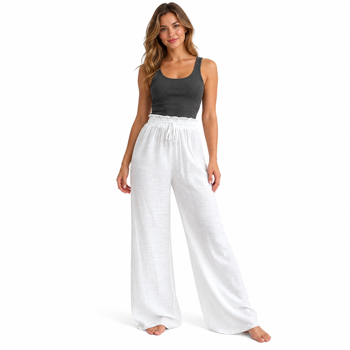 White wide leg pants with a drawstring waist on a full-body female model