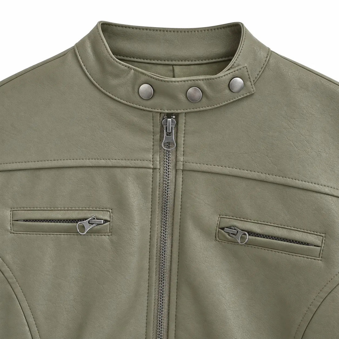 Gray Green stand collar detail showing three silver studs, with the front zipper, chest zips and shoulder stitching on white.