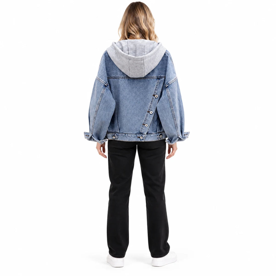 Full body rear view of an adult model wearing the washed blue jacket, showing a hood, diagonal rear buttons and long sleeves.