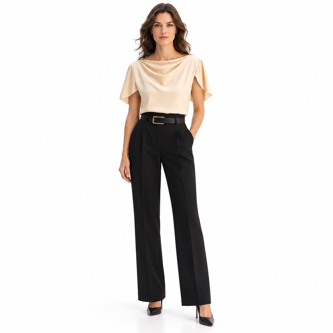 Front view of apricot draped blouse on full-length model wearing black trousers and heels, photographed on a white background
