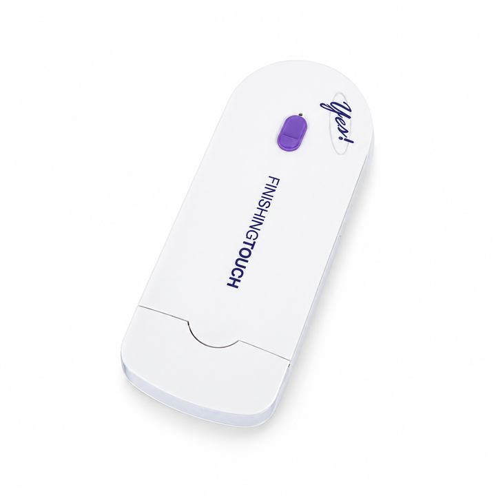 White and purple capped grooming device shown at a diagonal angle